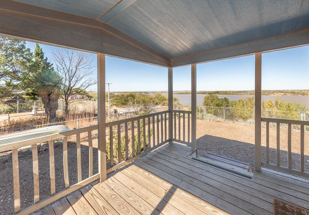145 Lakesite Drive Spur, TX 79370 - Photo 17 of 20 a view of balcony with wooden floor