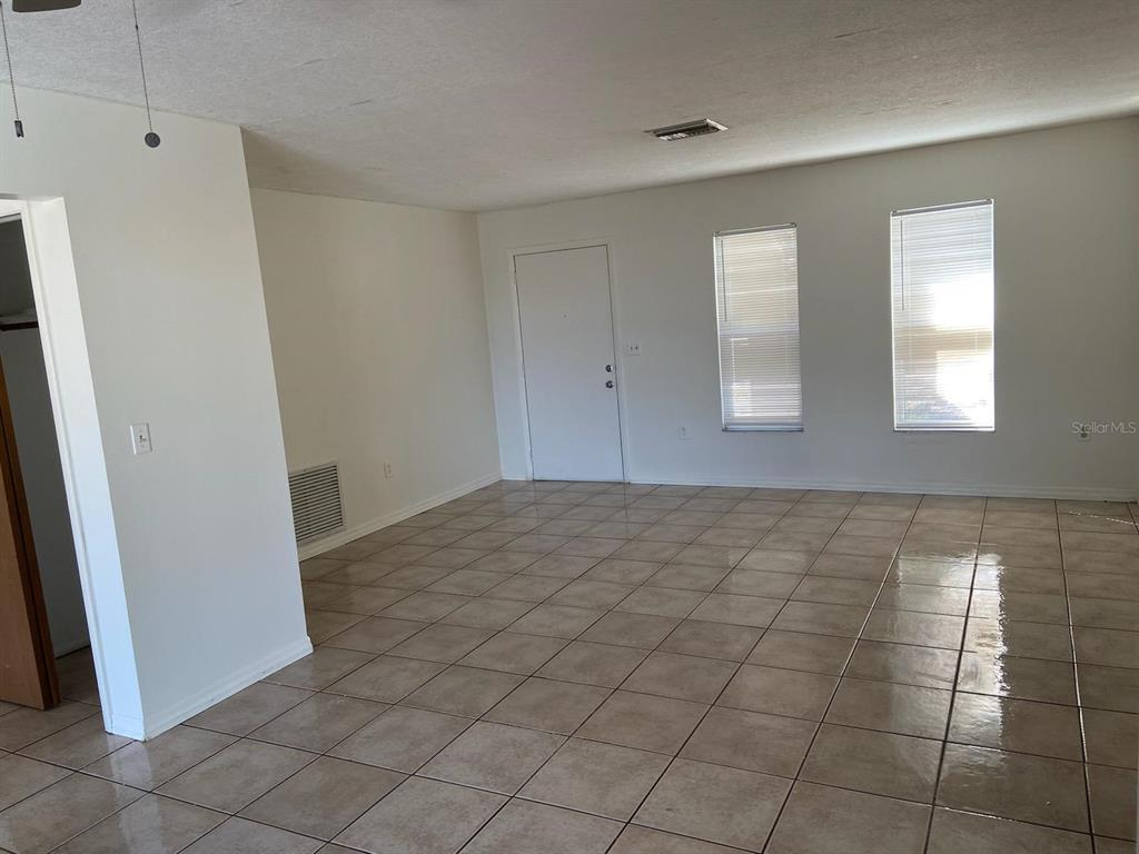 6429 Langston Avenue New Port Richey, FL 34653 - Photo 6 of 14 a view of an empty room and window