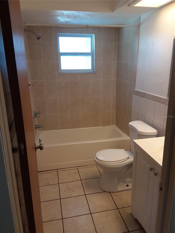 6429 Langston Avenue New Port Richey, FL 34653 - Photo 9 of 14 a bathroom with a toilet and a shower