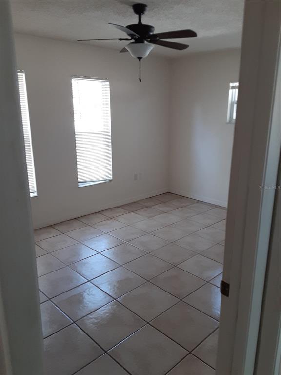 6429 Langston Avenue New Port Richey, FL 34653 - Photo 10 of 14 a view of an empty room and a window