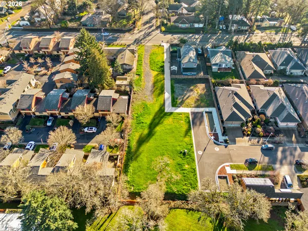 an aerial view of a house with swimming pool and outdoor space