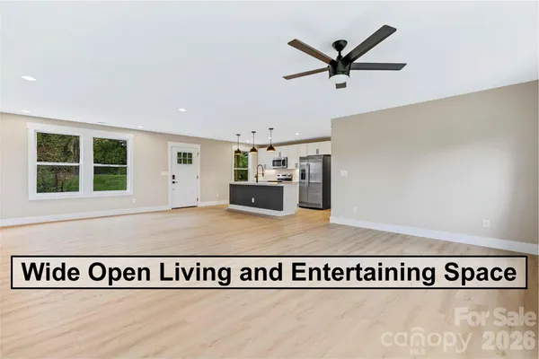 a view of a kitchen with furniture and windows