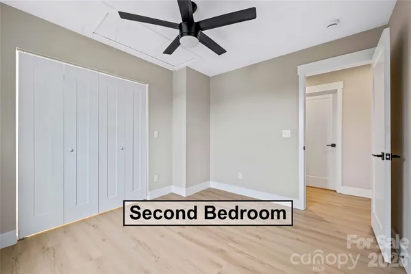 a view of a room with wooden floor