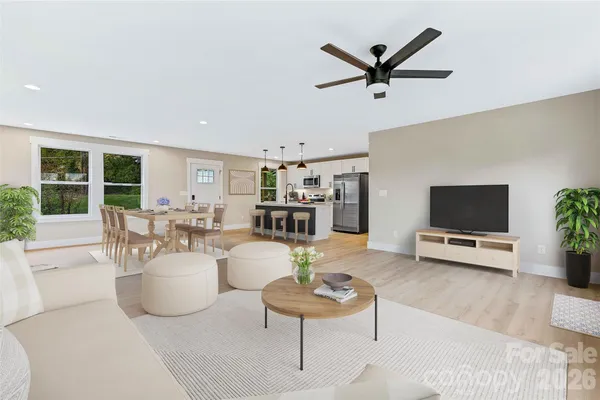 a living room with furniture and a large window