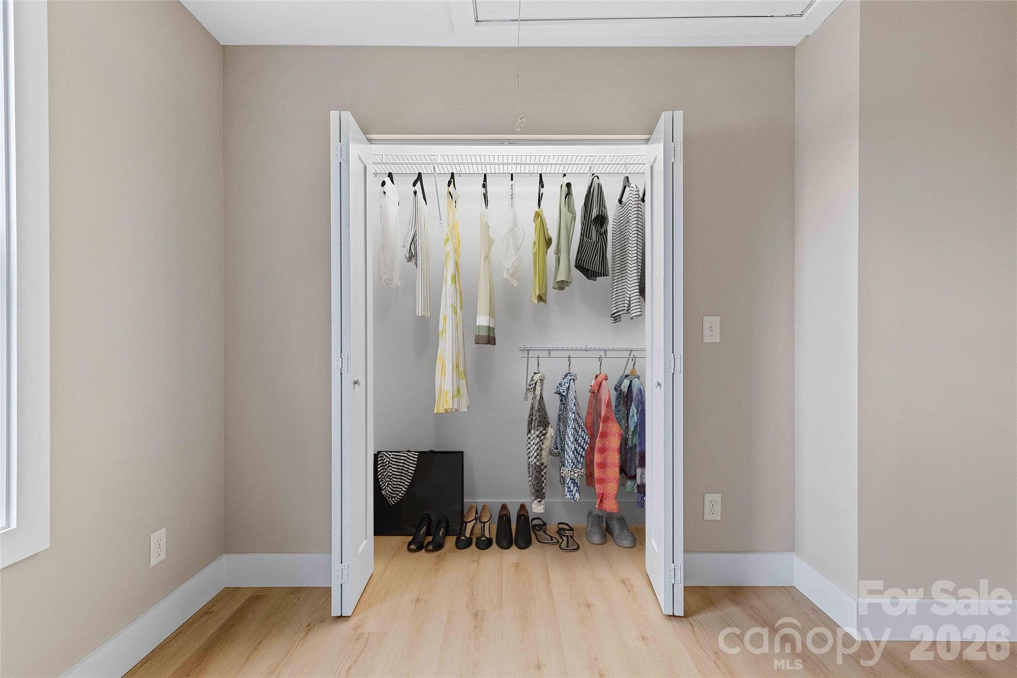 634 Beehive Road Hendersonville, NC 28792 - Photo 36 of 44 a view of walk in closet with clothes and shoes