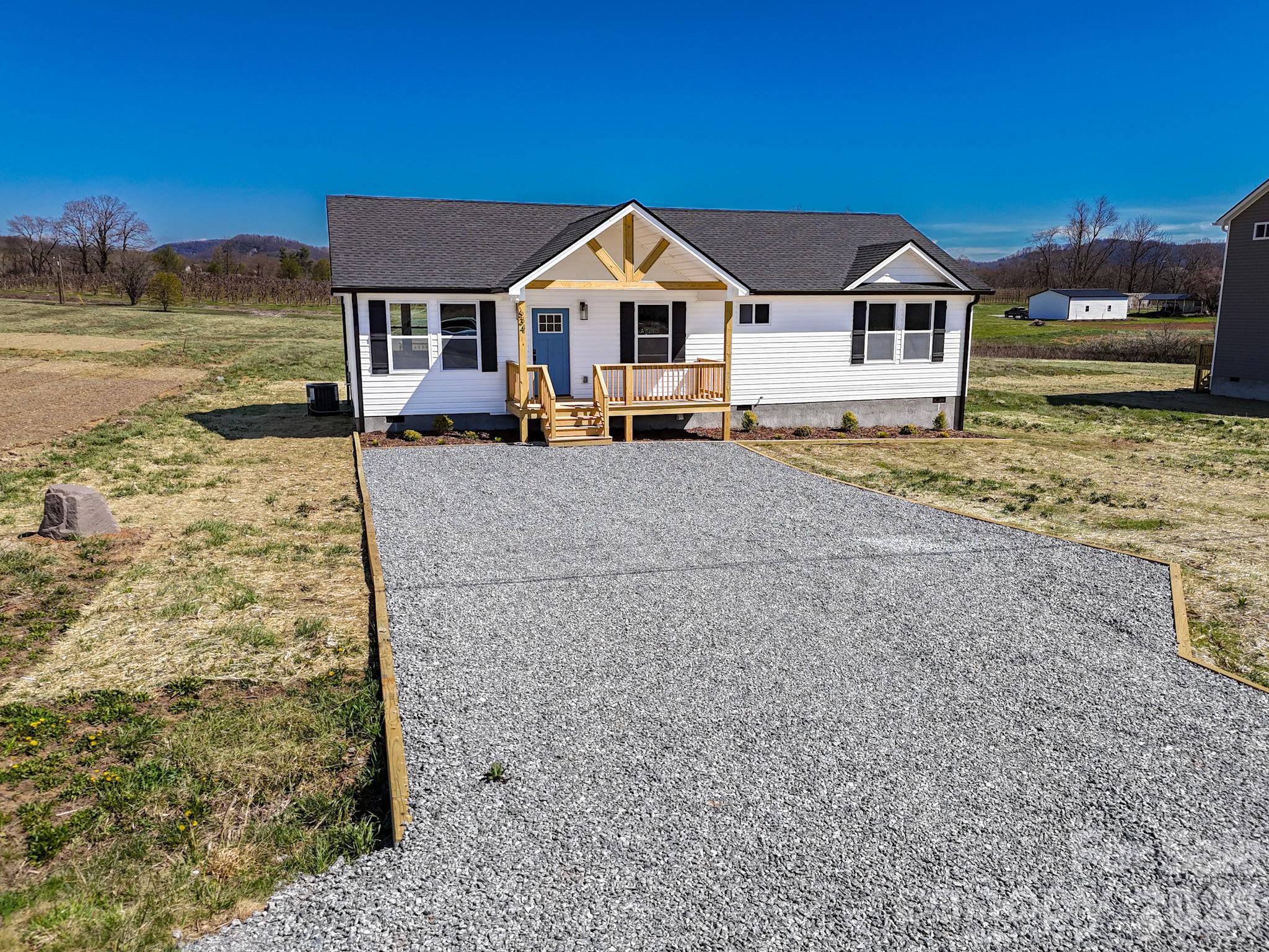 634 Beehive Road Hendersonville, NC 28792 - Photo 6 of 44 a front view of a house with a yard