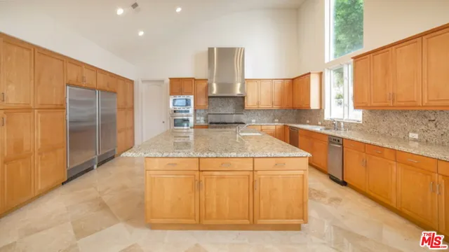 an aerial view of residential house and green space