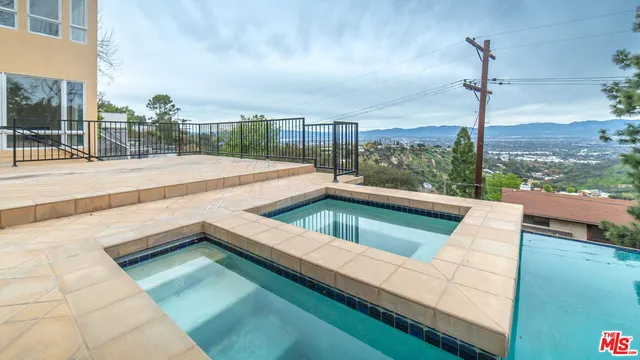 a view of swimming pool from a balcony