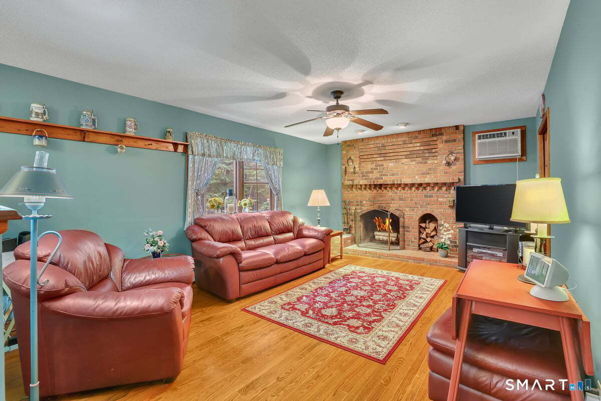 78 Mountain Ridge Drive Coventry, CT 06238 - Photo 14 of 39 The family room is perfectly located off of the kitchen and includes hardwood flooring and a wood burning fireplace.