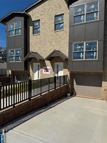 a view of front door and small yard