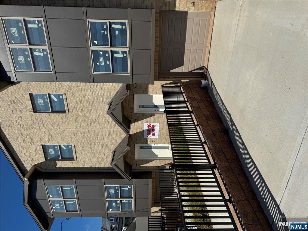 a view of front door and small yard