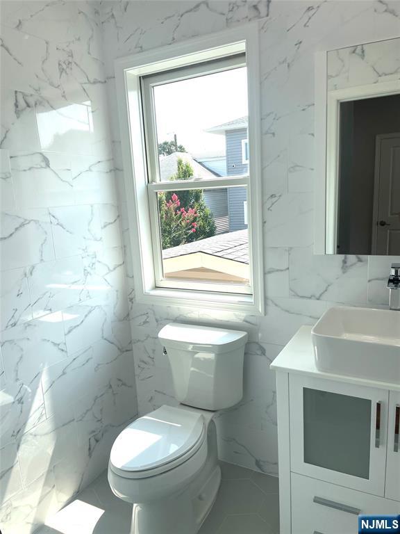 761 B 4th Street Secaucus, NJ 07094 - Photo 14 of 34 a bathroom with a sink toilet and shower