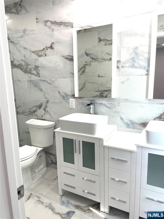 761 B 4th Street Secaucus, NJ 07094 - Photo 16 of 34 a bathroom with a sink toilet and shower
