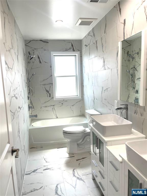 761 B 4th Street Secaucus, NJ 07094 - Photo 25 of 34 a bathroom with a sink toilet tub and shower