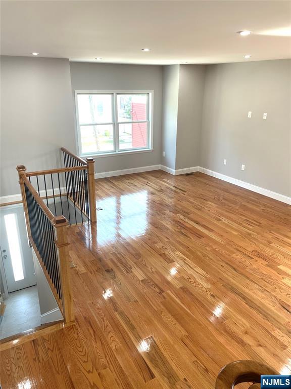 761 B 4th Street Secaucus, NJ 07094 - Photo 33 of 34 an empty room with wooden floor and windows