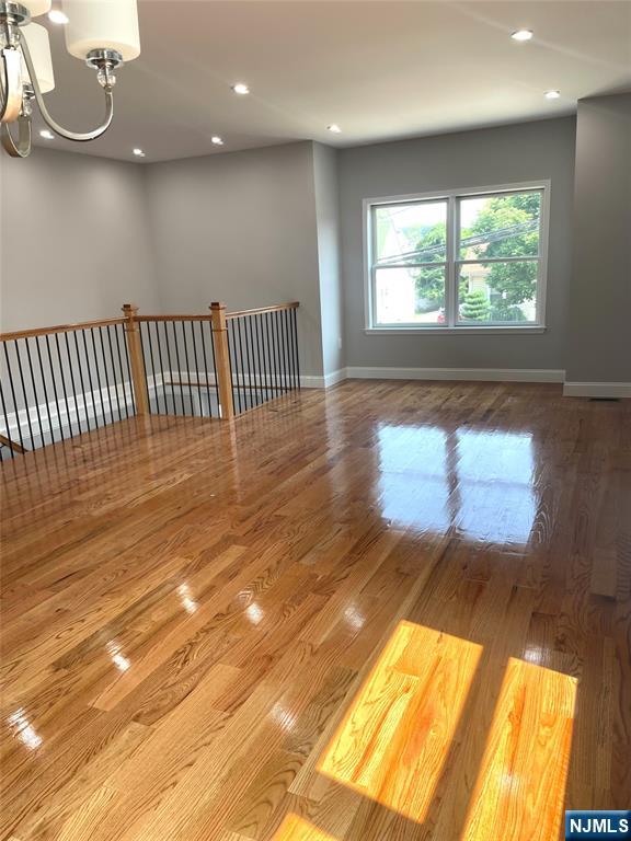 761 B 4th Street Secaucus, NJ 07094 - Photo 4 of 34 a view of an empty room with wooden floor and a window