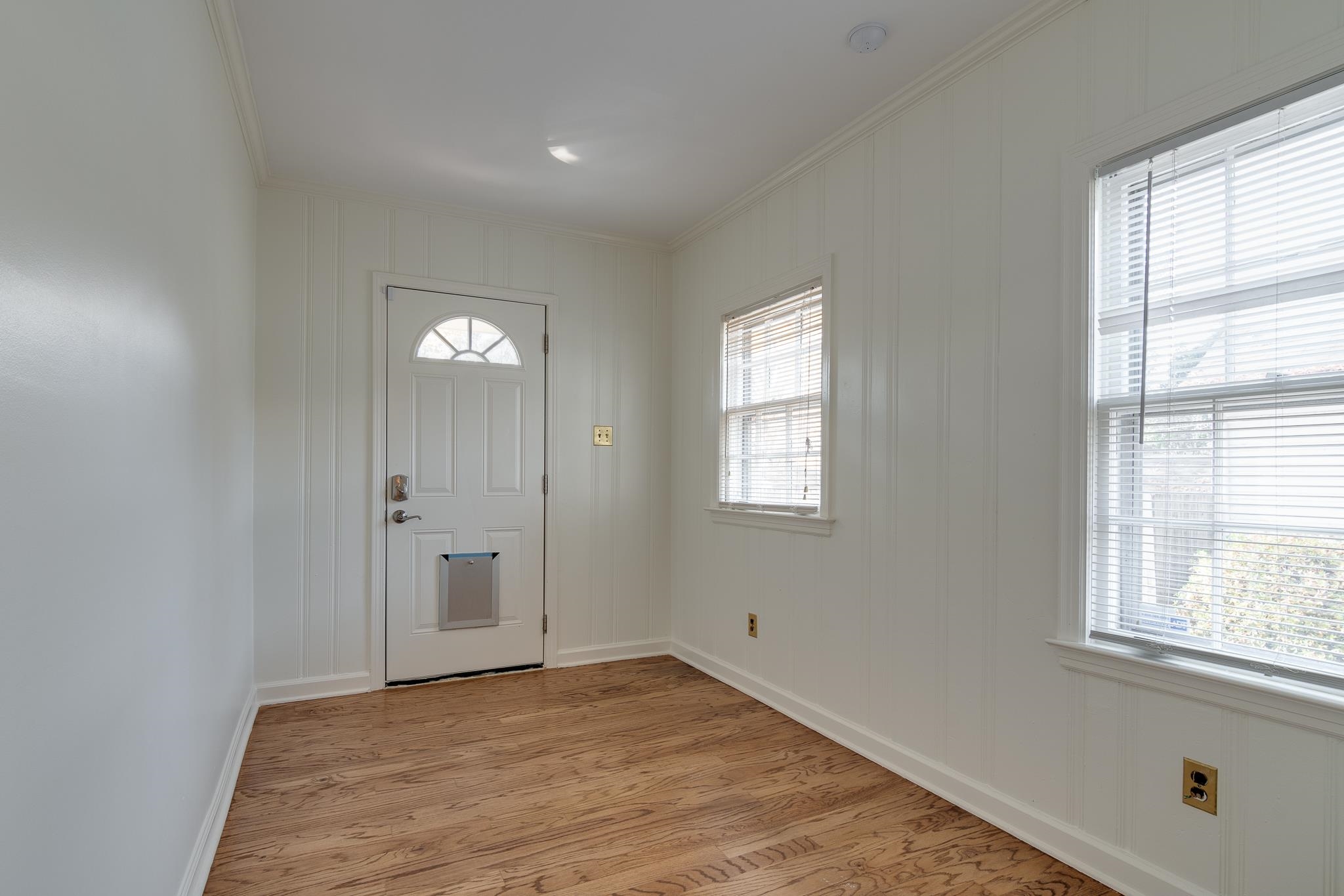 2767 Iroquois Road Memphis, TN 38111 - Photo 16 of 28 Foyer entrance with light wood-type flooring, crown molding, and plenty of natural light