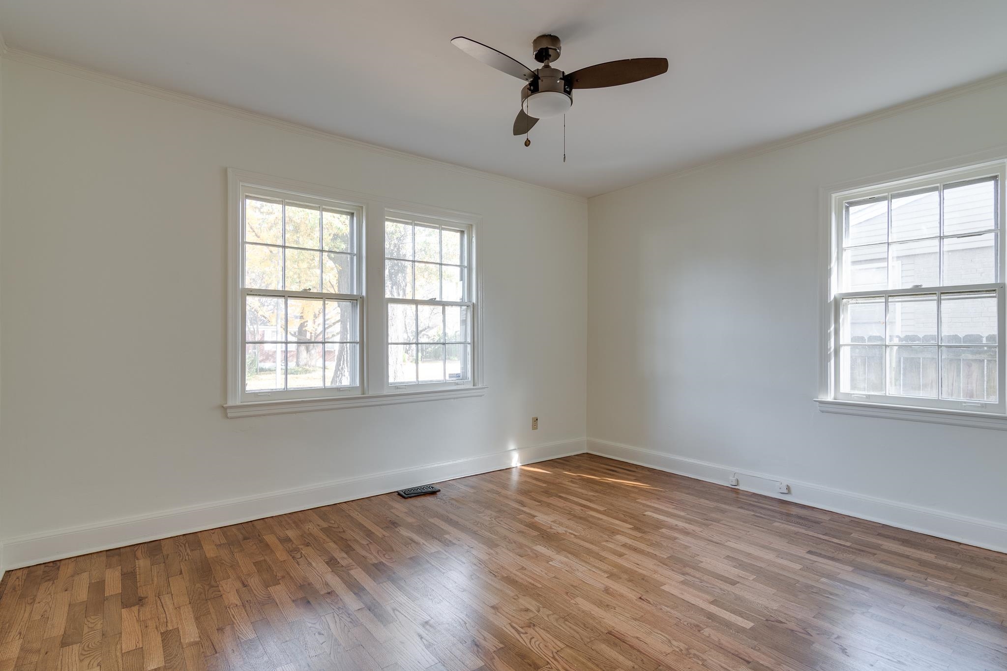 2767 Iroquois Road Memphis, TN 38111 - Photo 18 of 28 Spare room featuring ceiling fan and wood-type flooring