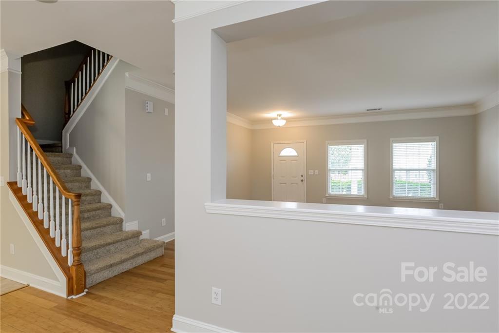 9337 Seamill Road Charlotte, NC 28278 - Photo 13 of 15 a view of a livingroom with wooden floor and stairs