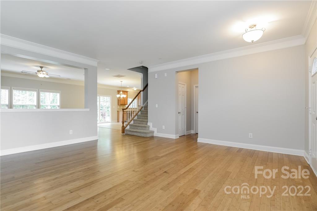 9337 Seamill Road Charlotte, NC 28278 - Photo 3 of 15 an empty room with wooden floor and windows