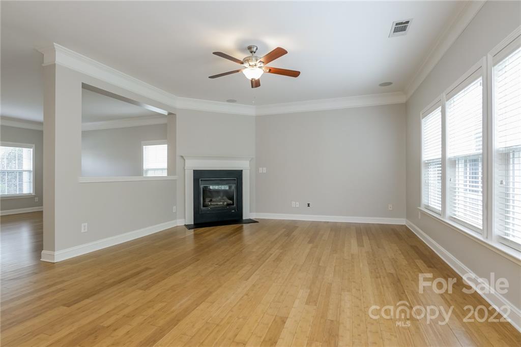 9337 Seamill Road Charlotte, NC 28278 - Photo 4 of 15 wooden floor in an empty room with a window