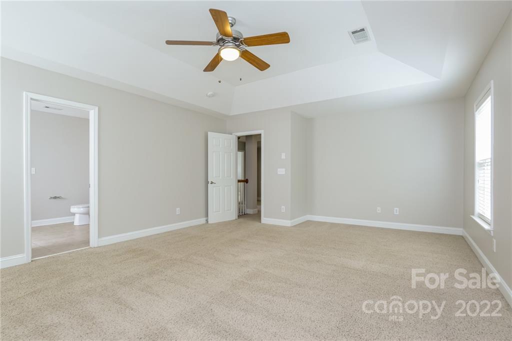 9337 Seamill Road Charlotte, NC 28278 - Photo 8 of 15 an empty room with closet and windows