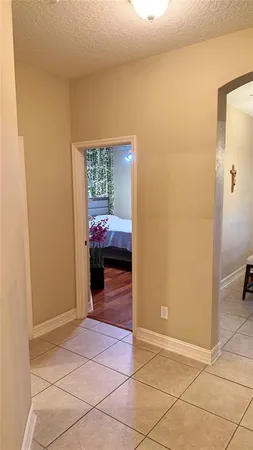 a view of a hallway to rooms