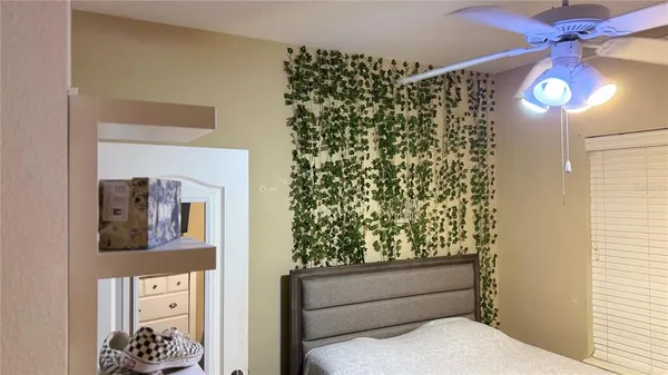 a bathroom with a toilet and a shower curtain