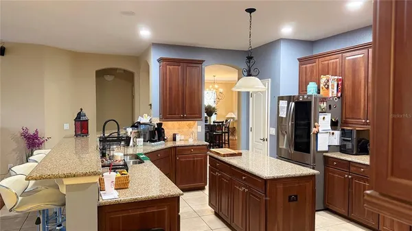 a kitchen with a sink stove and refrigerator