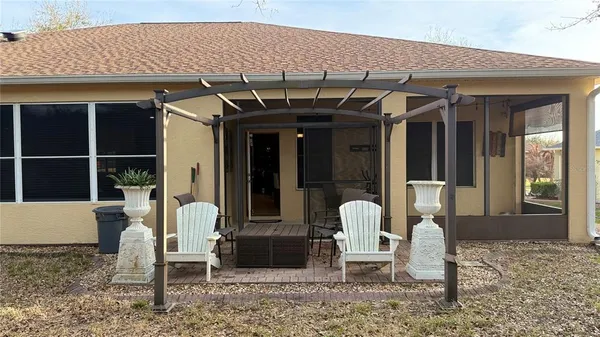 a view of a chairs and table in patio