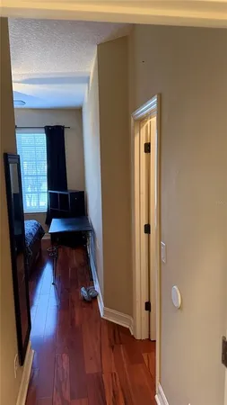 a view of front door with wooden floor