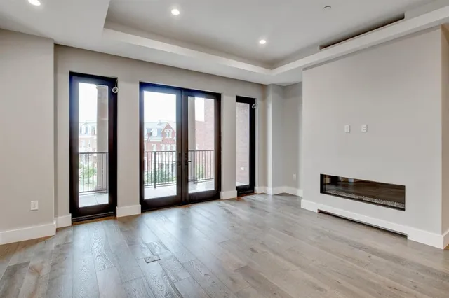 a view of an empty room with glass door