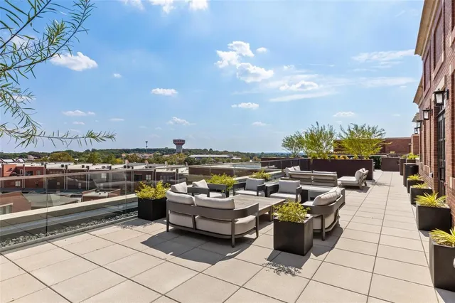 a view of a terrace with furniture and a table