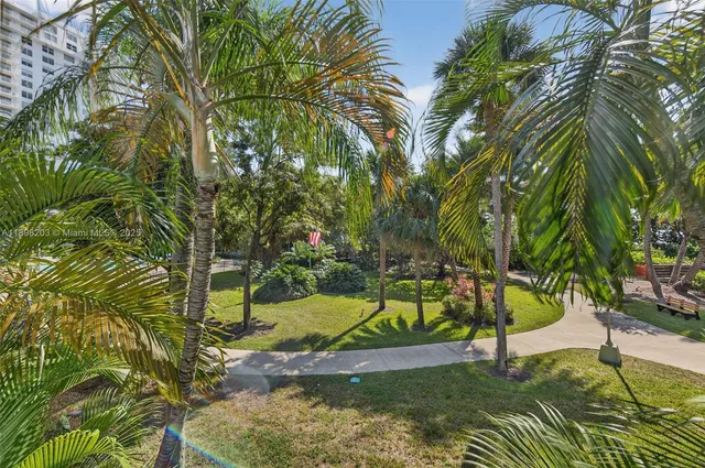 a view of a yard with swimming pool