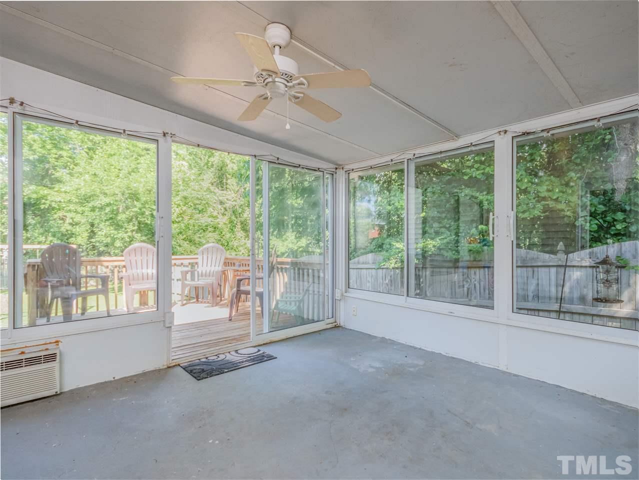 5402 Dorcas Street Raleigh, NC 27606 - Photo 14 of 18 a view of an empty room with wooden floor and a window