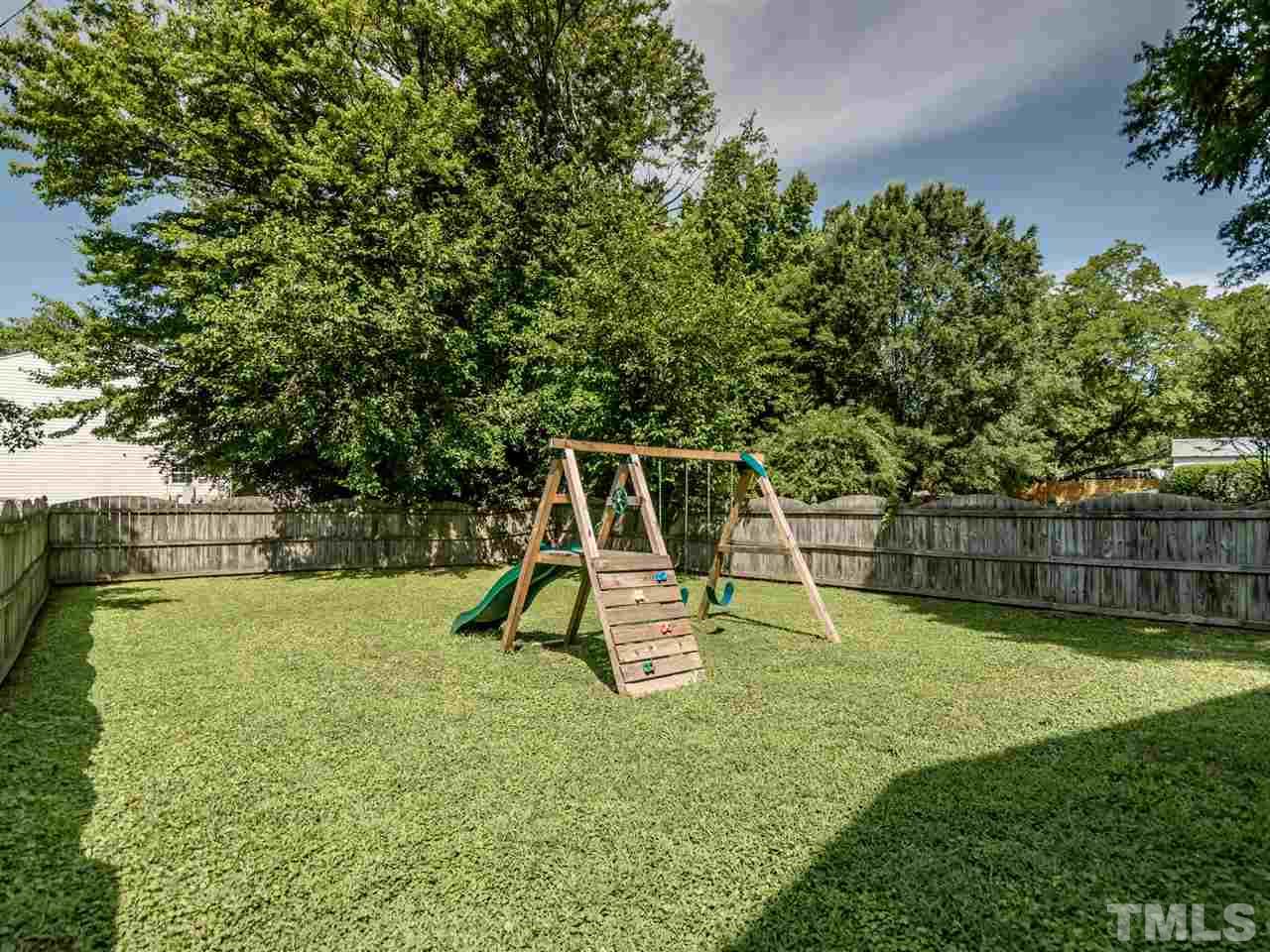 5402 Dorcas Street Raleigh, NC 27606 - Photo 17 of 18 a view of a park with slide