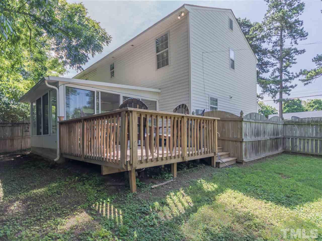 5402 Dorcas Street Raleigh, NC 27606 - Photo 18 of 18 a view of a house with a yard and deck