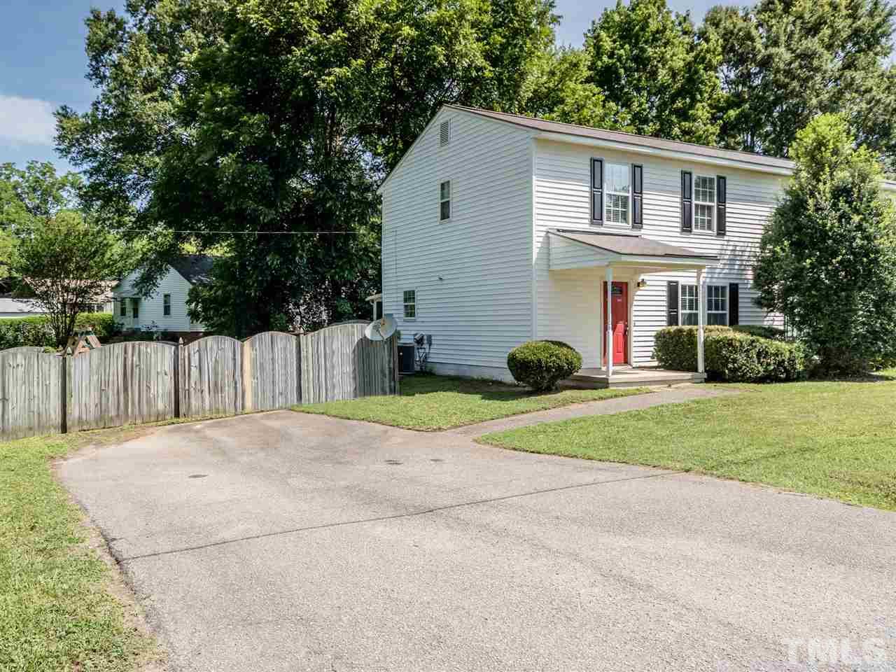 5402 Dorcas Street Raleigh, NC 27606 - Photo 3 of 18 a view of a house with backyard and trees