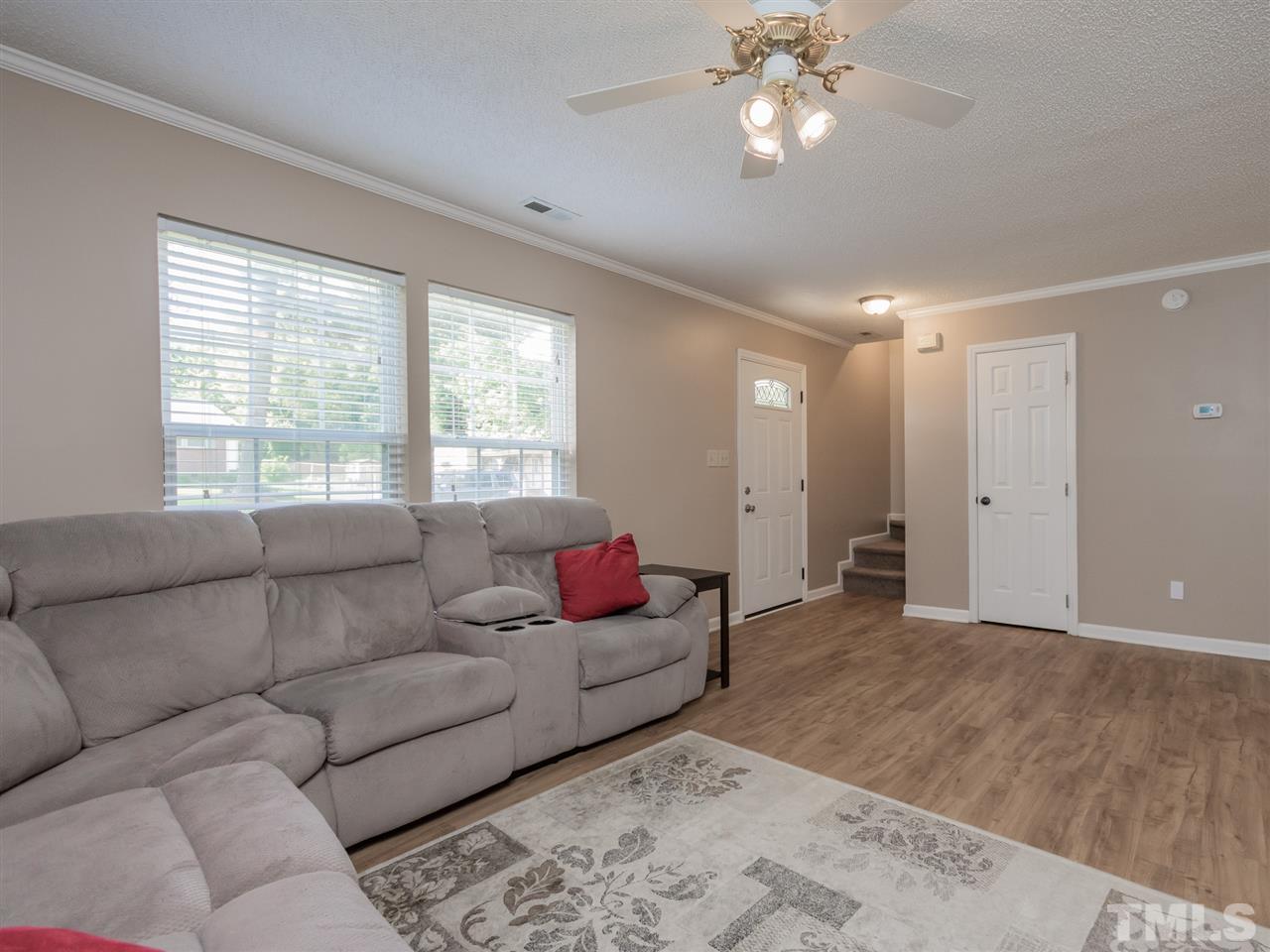 5402 Dorcas Street Raleigh, NC 27606 - Photo 6 of 18 a living room with furniture and a large window