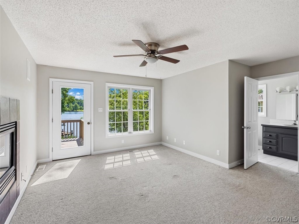 2249 Lakeview Drive Powhatan, VA 23139 - Photo 11 of 38 a view of a livingroom with a ceiling fan and window