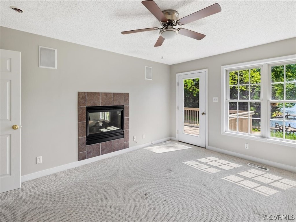 2249 Lakeview Drive Powhatan, VA 23139 - Photo 12 of 38 a view of an empty room with a window and a kitchen
