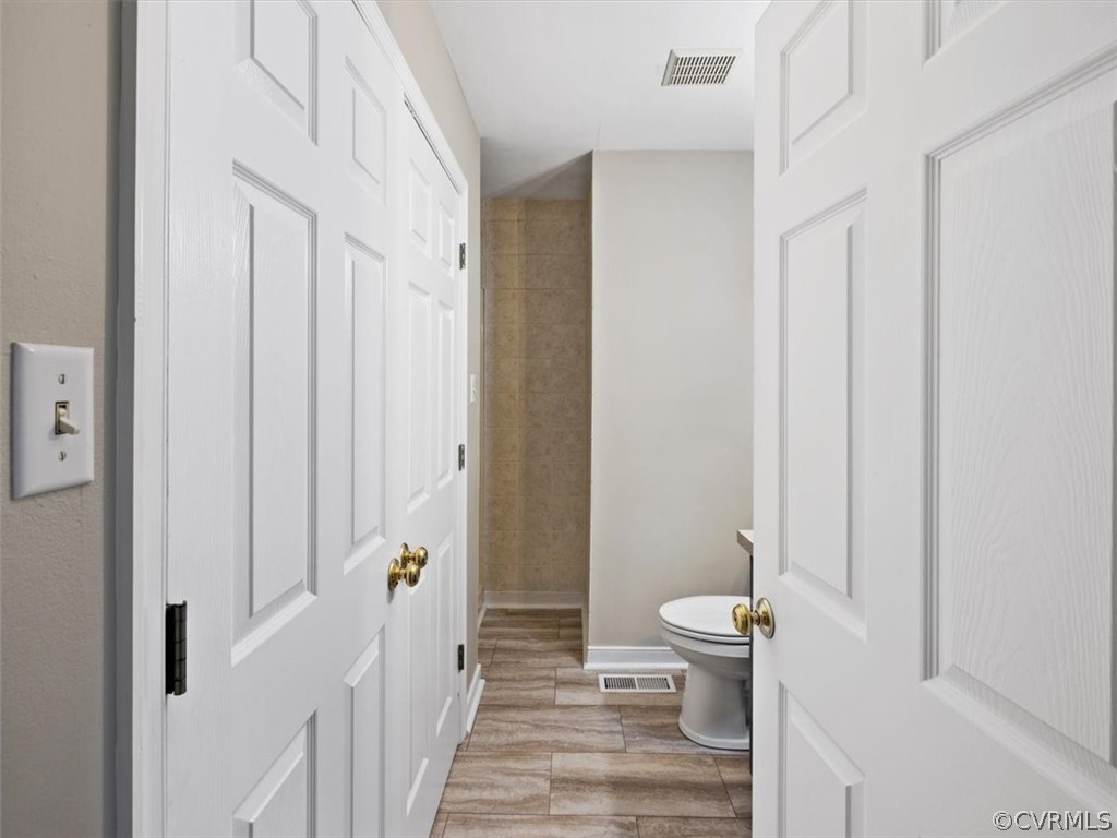 2249 Lakeview Drive Powhatan, VA 23139 - Photo 16 of 38 a bathroom with a toilet and a shower