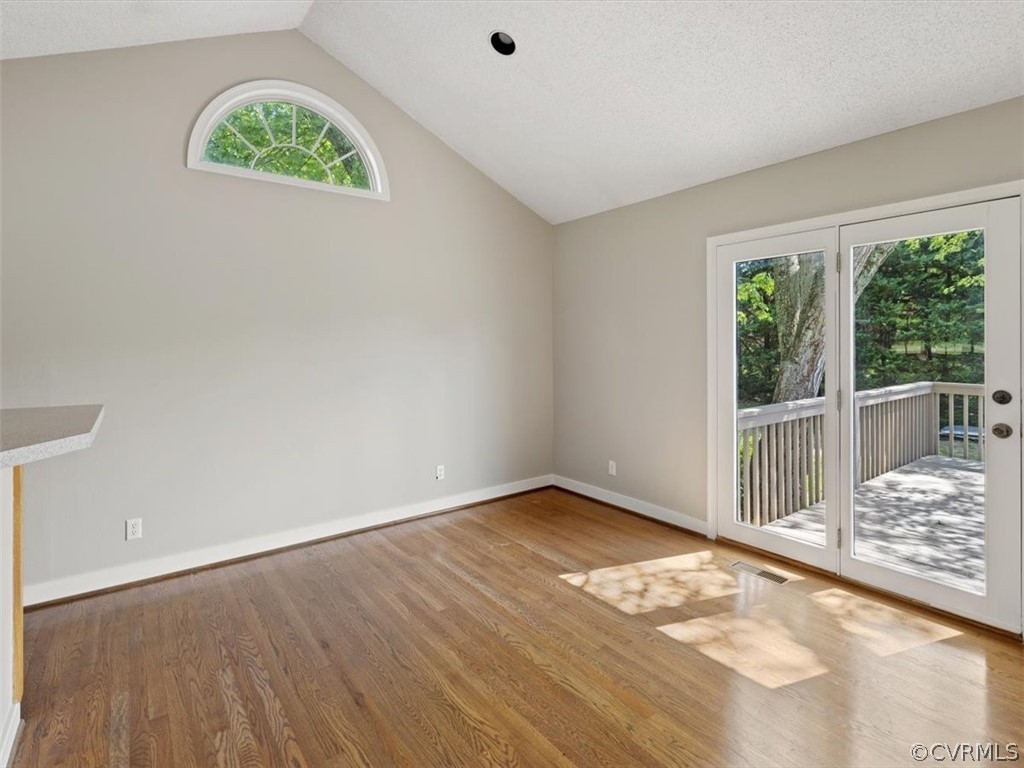 2249 Lakeview Drive Powhatan, VA 23139 - Photo 6 of 38 an empty room with wooden floor and a window