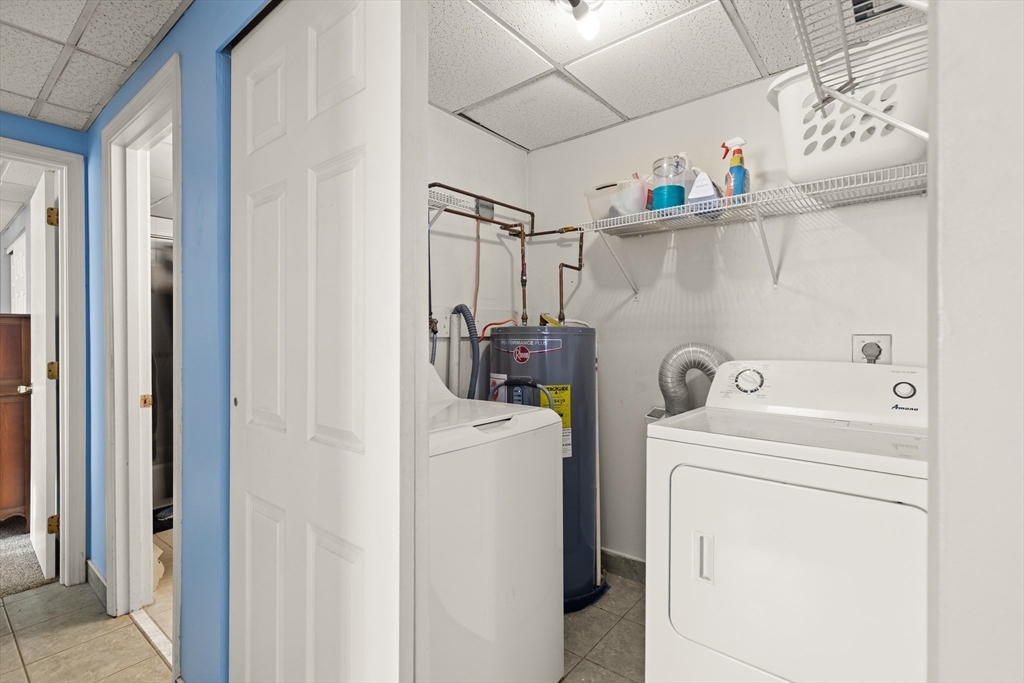 111 Foster Street, Unit 305 Peabody, MA 01960 - Photo 15 of 24 a utility room with dryer and washer