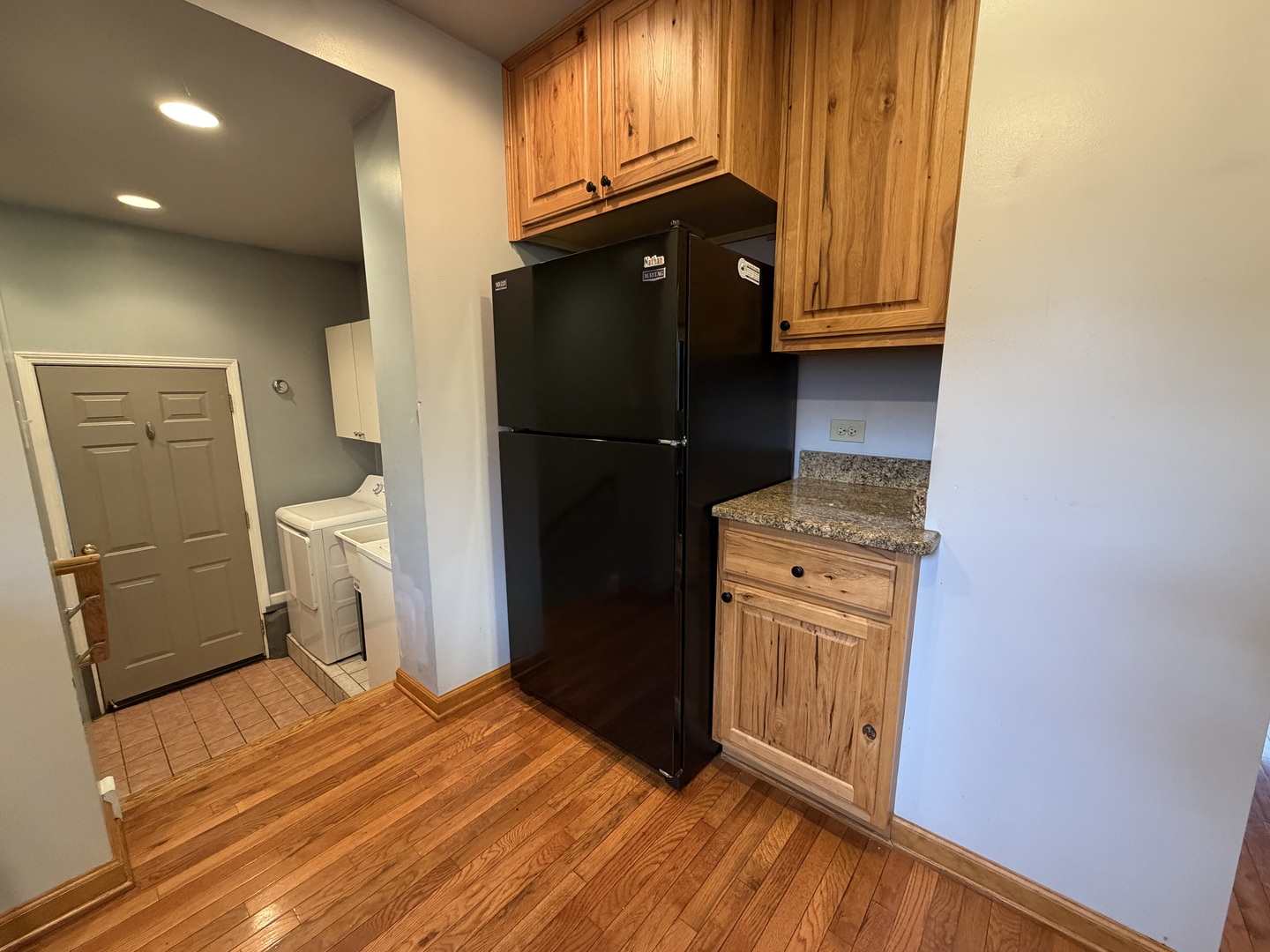 7841 45th Place Lyons, IL 60534 - Photo 15 of 23 a kitchen with a refrigerator and a stove