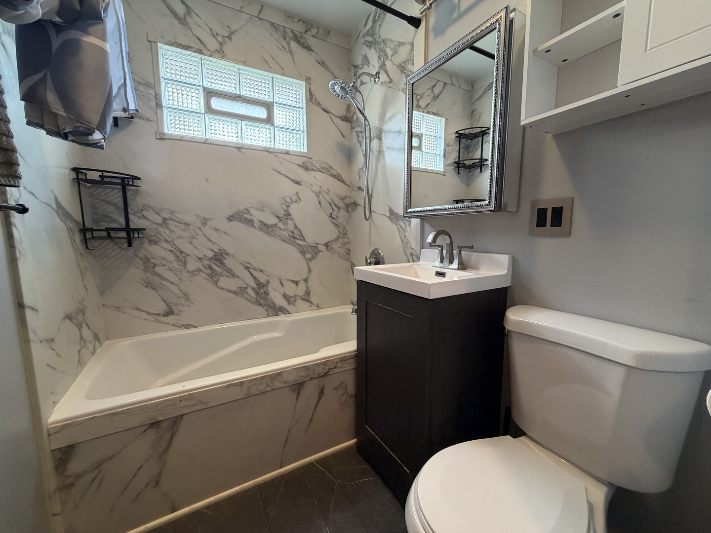 7841 45th Place Lyons, IL 60534 - Photo 16 of 23 a bathroom with a sink toilet and a bathtub