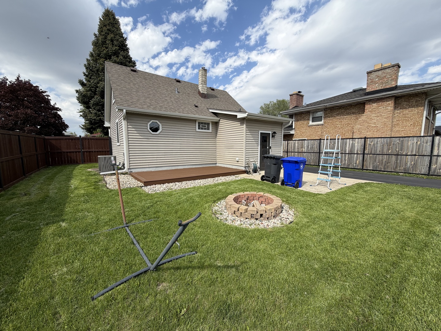 7841 45th Place Lyons, IL 60534 - Photo 22 of 23 a front view of a house with a yard and garage