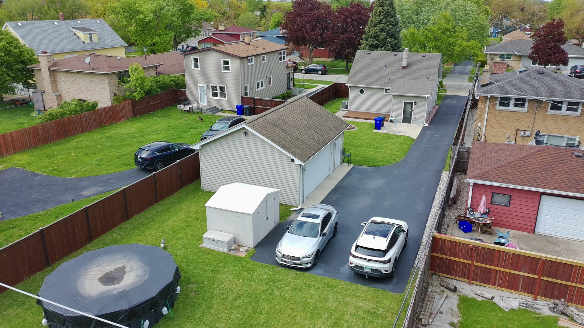7841 45th Place Lyons, IL 60534 - Photo 7 of 23 an aerial view of a house with garden space and a car parked in the park