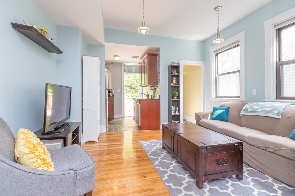 40 Rockview Street, Unit 4 Boston, MA 02130 - Photo 2 of 8 a living room with furniture and a flat screen tv