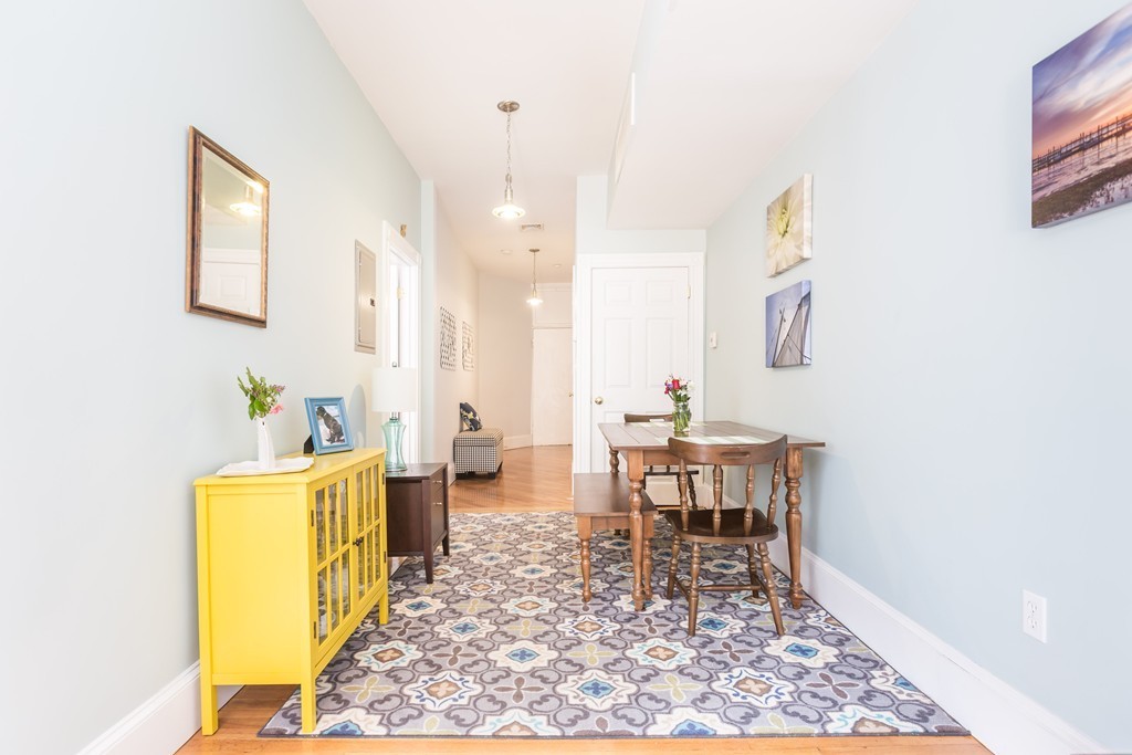 40 Rockview Street, Unit 4 Boston, MA 02130 - Photo 3 of 8 a view of a dining room with furniture and a table